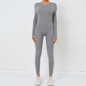 Close-up of gray long sleeve yoga bodysuit with functional thumb holes and slim fit cut