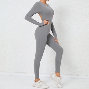 Close-up of backless yoga jumpsuit with thumbholes and high-stretch grey fabric