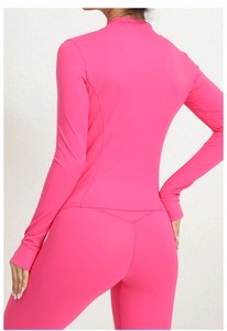 Detail showing back stitching and body-sculpting fit of the rose pink sports set