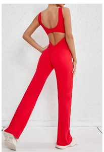 Macro view of the ruched peach butt lift detail and open back of this red jumpsuit