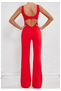 Close-up of ruched peach lift detail and backless design on red flare yoga jumpsuit
