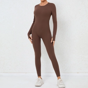 Detail of dark brown yoga jumpsuit featuring thumb holes and high-stretch fabric