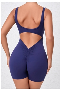 Detail view of deep blue seamless yoga romper showing scrunch butt and open back design
