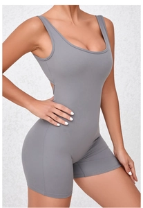 Close-up of grey quick-dry yoga bodysuit featuring wide straps and athletic U-neck cut