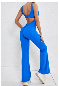 Detail of open back design and ruched butt lifting effect on bright blue yoga jumpsuit