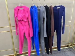 Detail of back cutout and slim fit design on multi-colored yoga jumpsuits