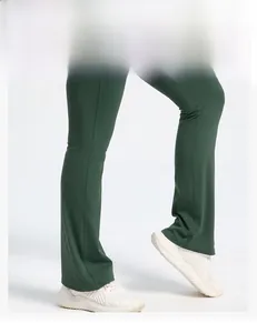 Detail of flare leg yoga jumpsuit with slimming fit and bootcut silhouette in dark green