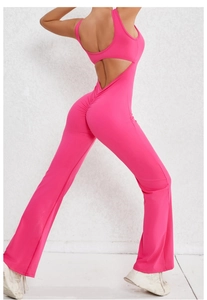 Detail of rose red open back yoga jumpsuit featuring ruched butt lifting and flared legs
