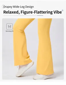 Detail der leuchtend gelben Yoga-Schlaghose mit dehnbarem Stoff und weitem Bein-Design