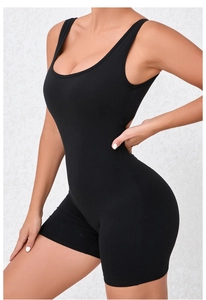 Detail view of the seamless black bodysuit showing elastic fabric and U-neckline fit