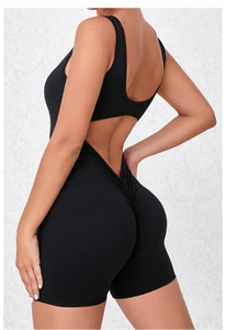 Detail view of black backless sports romper featuring scrunch butt and racerback design