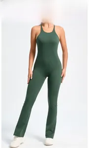 Detail view of dark green jumpsuit featuring flared legs and adjustable straps