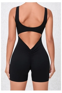 Detail of the scrunch butt and triangle cutout back on this black fitness jumpsuit