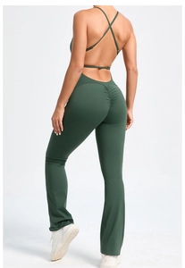 Detail of forest green backless yoga bodysuit with thin cross straps and scrunch butt design