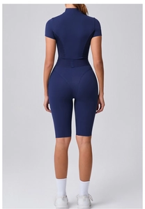 Detailed back view showing ergonomic seams and shaping of the navy blue yoga bodysuit