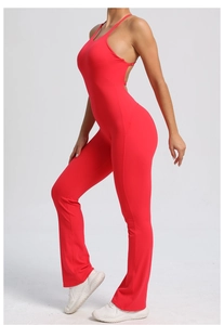 Close-up of red yoga bodysuit featuring backless cross straps and flared leg design