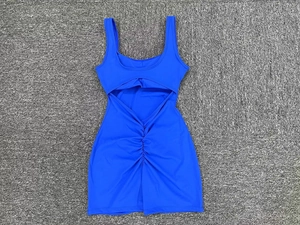 Detailed back view of royal blue yoga bodysuit featuring oval cutout and ruched center seam