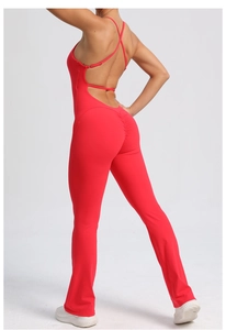 Close-up of red backless yoga jumpsuit with cross straps and ruched butt lifting detail