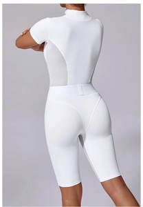 Detail view of breathable white yoga bodysuit featuring mesh panels and slim fit design