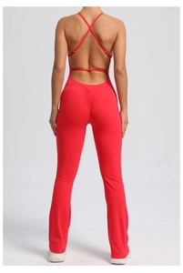 Detailed back view of red flare yoga jumpsuit with cross straps and scrunch butt effect