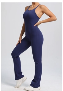 Deep blue backless yoga bodysuit featuring adjustable straps and flared leggings style