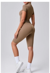 Detail of moisture-wicking mesh stitching and back-slimming cut on brown yoga bodysuit