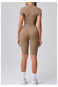 Rear view of brown yoga bodysuit with ergonomic stitching and mesh splicing details