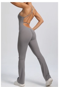 Detail of grey yoga bodysuit featuring cross back straps and scrunch butt lifting texture