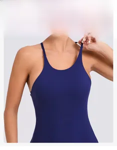 Detail of navy blue yoga bodysuit featuring a U-neck and thin straps with snug fit design