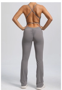 Detail of cross-back adjustable straps and peach-lift scrunched back on flare yoga jumpsuit