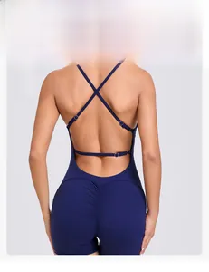 Close-up of ruched detail and adjustable cross back straps on blue fitness bodysuit