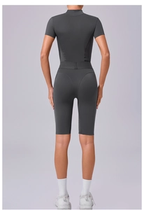 Back view of dark grey athletic bodysuit with ergonomic seams and supportive waistband
