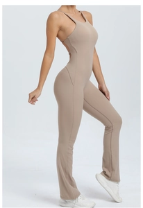 Detail of nude flared jumpsuit with adjustable straps and open back for yoga and fitness