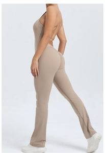 Detail of khakibrown backless yoga jumpsuit featuring adjustable straps and flared leggings