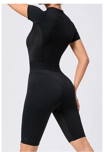Detail showing breathable mesh panels and high-stretch fabric of black yoga bodysuit