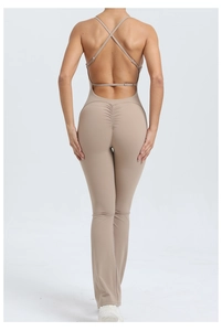 Detail of cross straps and peach lift seam on backless flare yoga jumpsuit