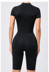 Rear view of black yoga jumpsuit showing ergonomic seams and breathable mesh panels