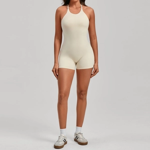 Front view of sleeveless backless cream yoga bodysuit for women in high-stretch fabric