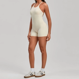 Detail view of the cream backless yoga jumpsuit showing sleek fabric and slim fit