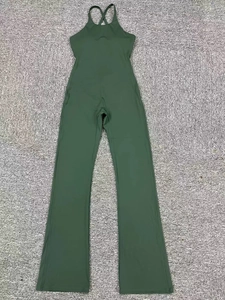 Flat lay of army green yoga jumpsuit with backless neck design and flared leggings