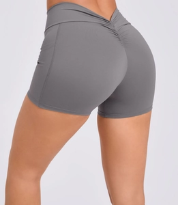Detail of high waist grey yoga shorts with back V-shape seam and scrunch butt lifting design