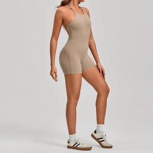 Close-up of the cross-back straps and elastic fabric texture of this yoga bodysuit