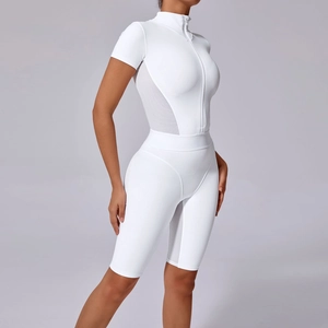 Short sleeve white yoga bodysuit with mesh panels and zipper front for athletic women