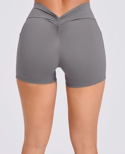 Detail view of high waist V-cut yoga shorts with scrunch butt lift design in dark grey
