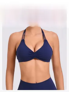 Detail of navy blue halter yoga top featuring a sweetheart neck and double thin straps