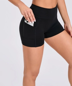 Close-up of high-waisted yoga shorts featuring functional side pockets for mobile phones