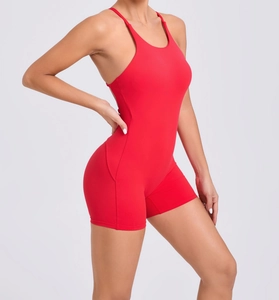 Detail view of red high-elastic seamless yoga bodysuit highlighting body contour and fit