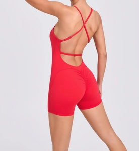 Detailed view of the red backless yoga bodysuit with cross straps and ruched butt lifting