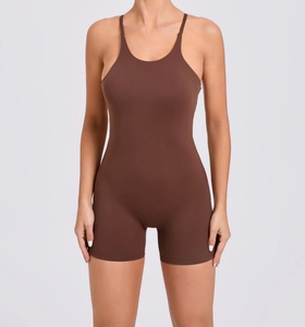 Detail of thin straps and round neckline on a dark brown body-hugging yoga bodysuit