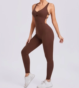 Detail of deep V-neck and racerback cutout on a brown yoga jumpsuit for women